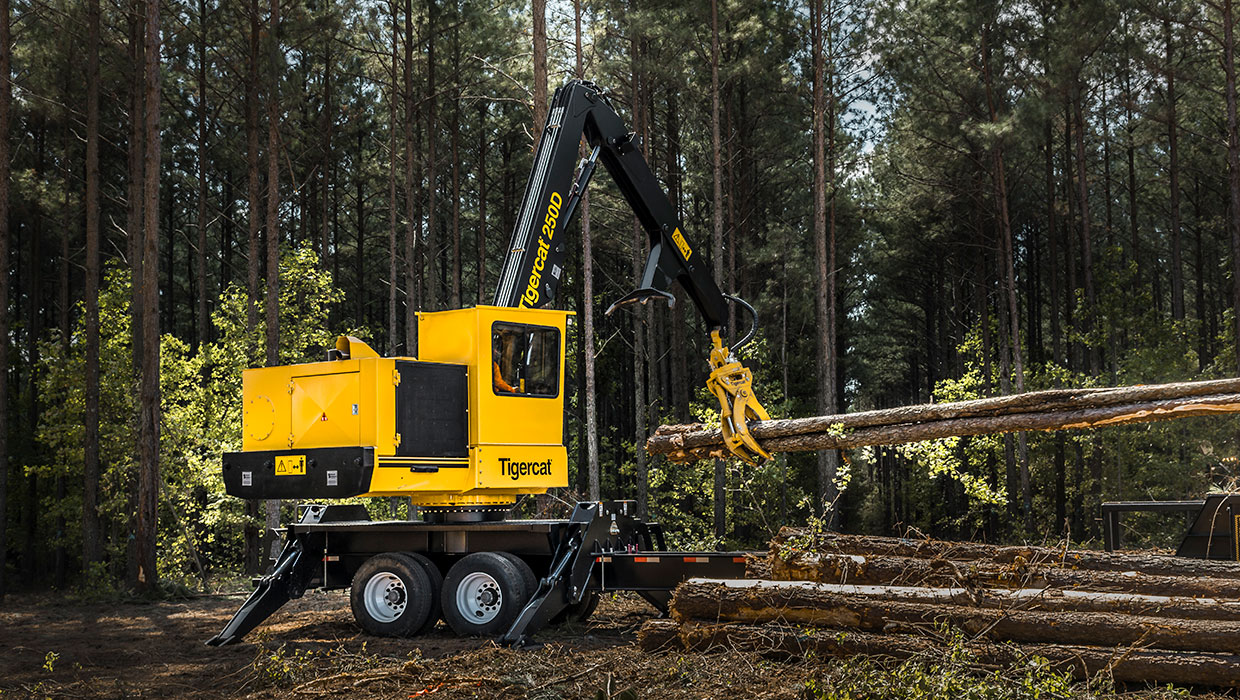 Image of a Mackolines Machines & Hire 250D knuckleboom loader working in the field