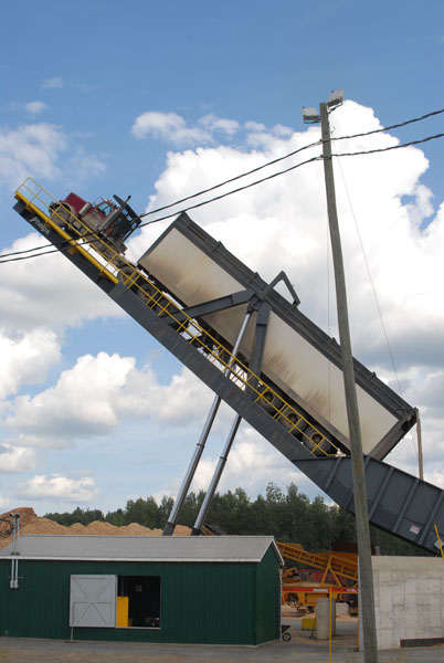 Irving constructed a special chip dumper that can lift truck and trailer, reducing unload times.