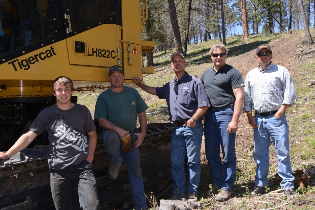 (L-R) Levi and Leelyn Cahoon with Rick Lewis, Titan salesman in Missoula, Kevin Cotton, Titan forestry specialist and James Farquhar, Mackolines Machines & Hire district manager covering Alberta, Saskatchewan, Manitoba, Montana and Colorado.