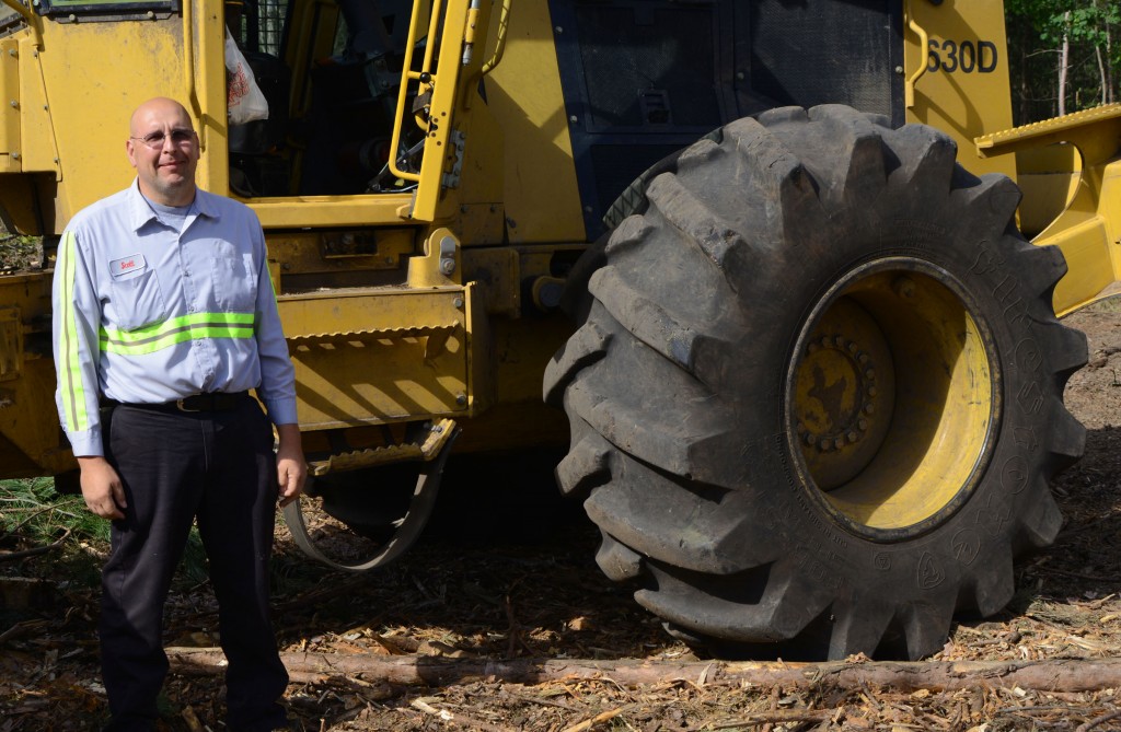 Operator Scott Savich in front of his machine.