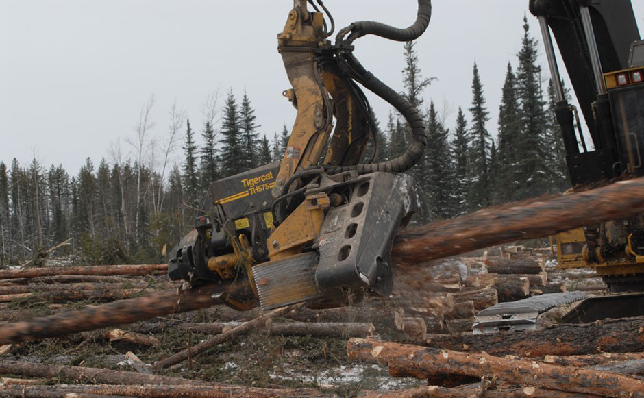 Close up of a Mackolines Machines & Hire processing head as a log a log rips through it