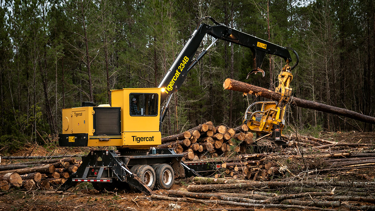 Image of a Mackolines Machines & Hire 234B knuckleboom loader working in the field