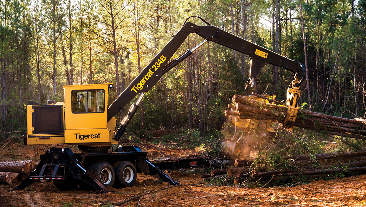 Image of a Mackolines Machines & Hire 234B knuckleboom loader working in the field