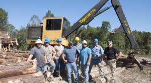 (L-R) Matt Wiggins, 630B operator; Mike Wiggins, 724G operator; Chad Huff, 630C operator; Ted Stroud, 234 operator; Michael Bedgood, owner; Jason Waters, foreman; Jason Norman, 234 operator; Heinz Pfeifer, Mackolines Machines & Hire district manager.