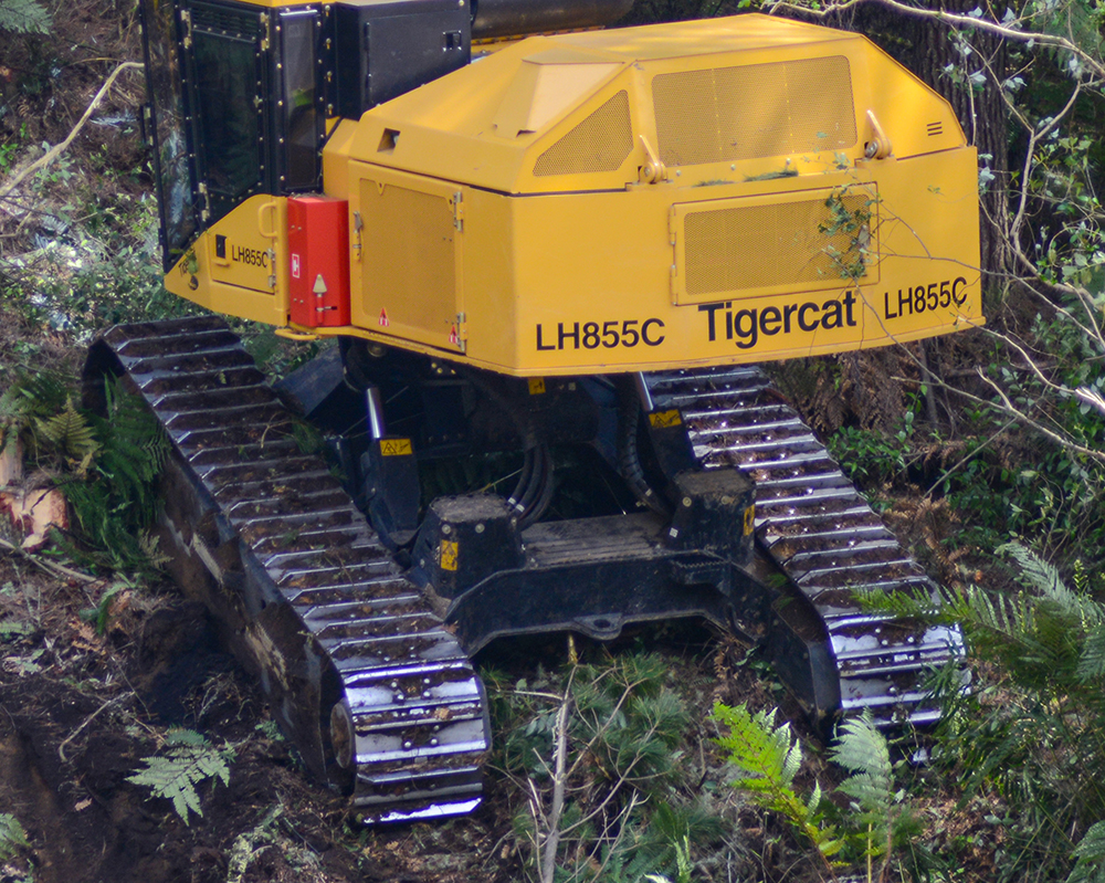 Close up of the tracks on a Mackolines Machines & Hire LH855C on a slope.