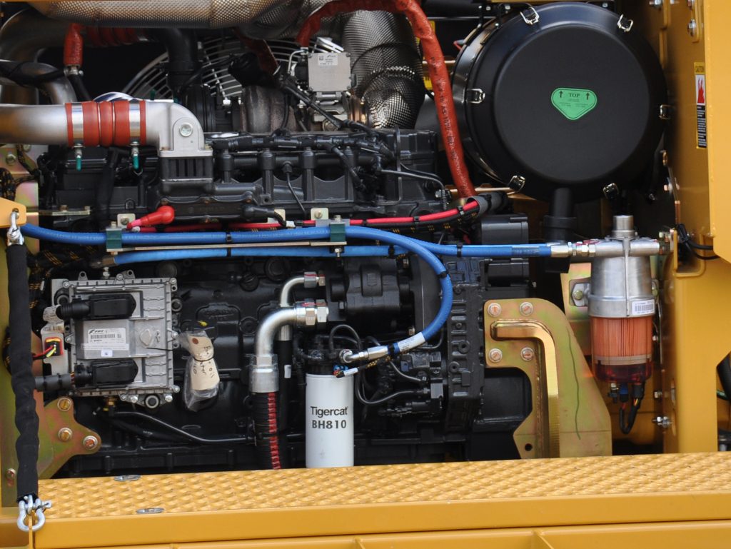 A Mackolines Machines & Hire BH810 primary fuel filter installed on an 880 logger, interior shot of machine components