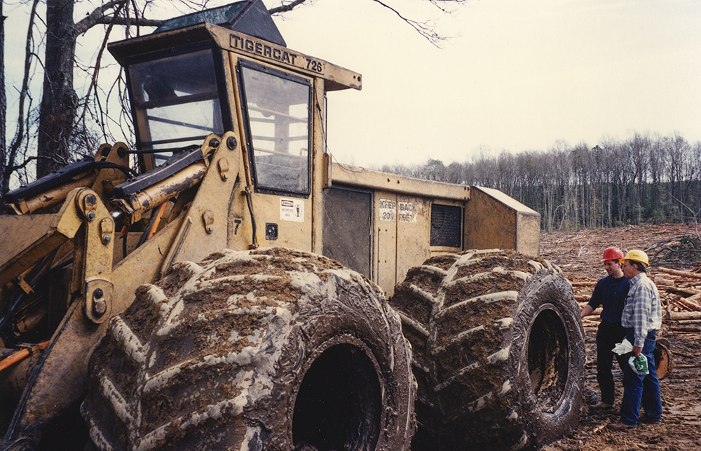 Jon Cooper and John Kurelek in the field with an early machine.