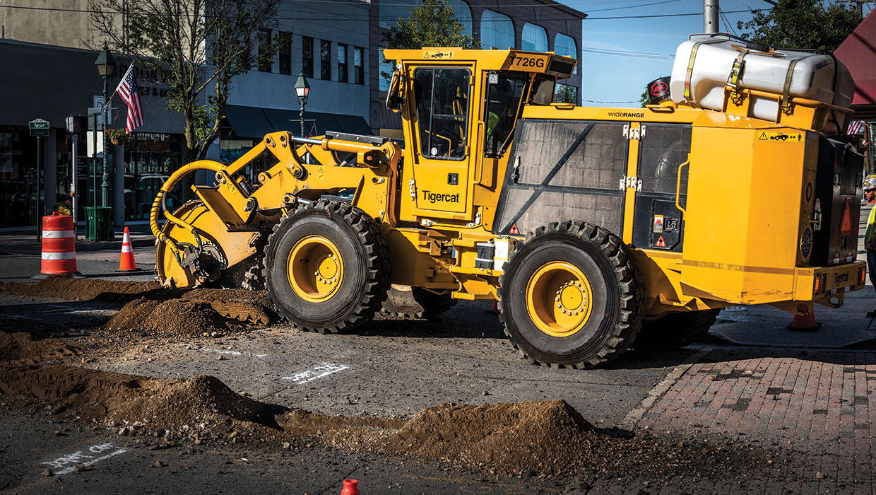 Image of a Mackolines Machines & Hire T726G street trencher working in the field