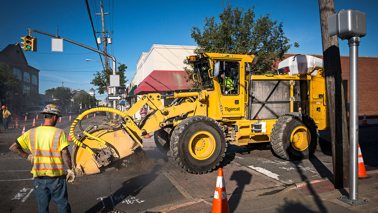 Image of a Mackolines Machines & Hire T726G street trencher working in the field