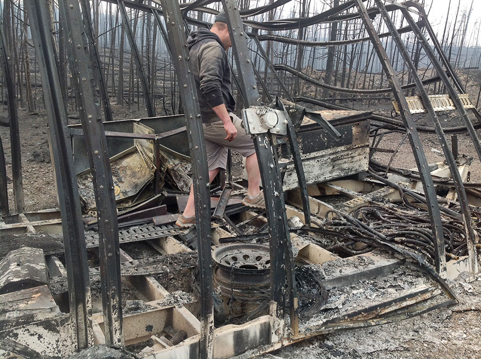 Ben navigates through the fire damaged logging camp in BC