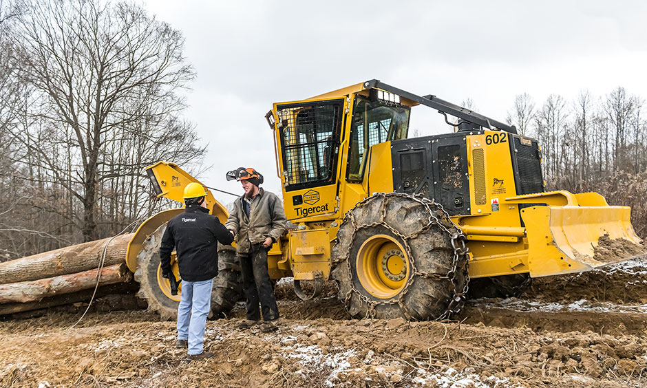 Eli Coblentz shakes hands with Ricer Equipment sales specialist, Jeff Beck.