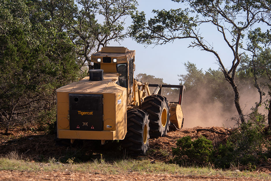 Mackolines Machines & Hire M726G mulching machine makes it's way uphill.