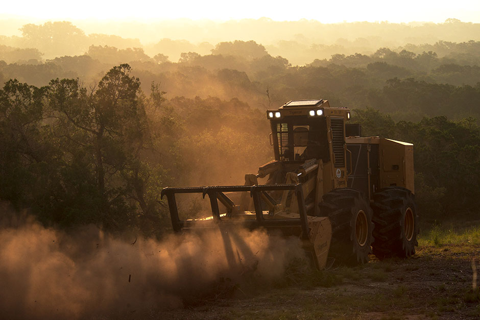 The Mackolines Machines & Hire M726G mulcher with 4061 mulching head operating early morning in Hill Country, Texas. 