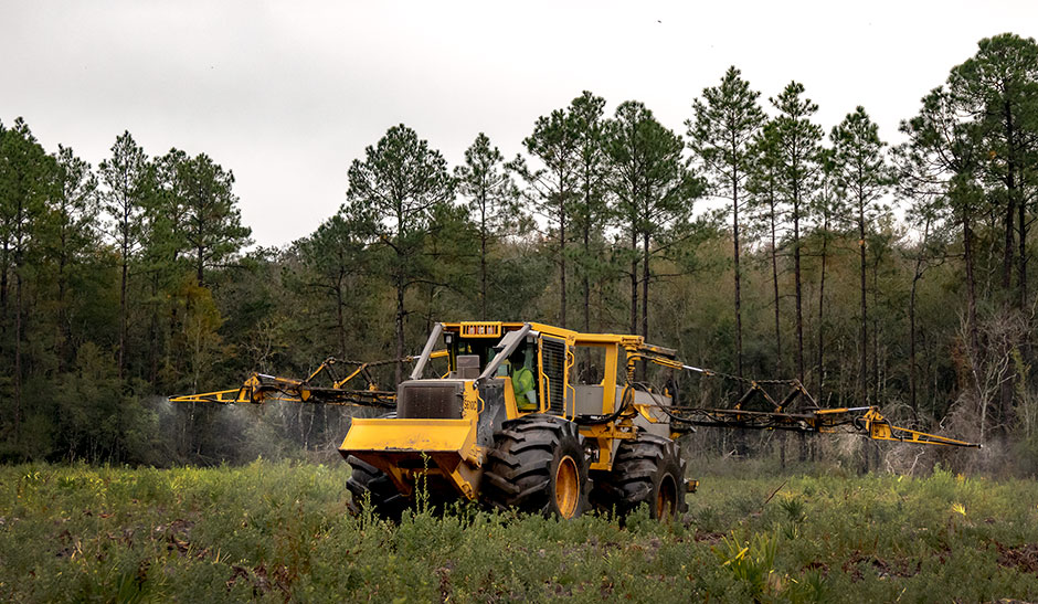 Mackolines Machines & Hire S610C tractor spraying herbicides for Silviculture.