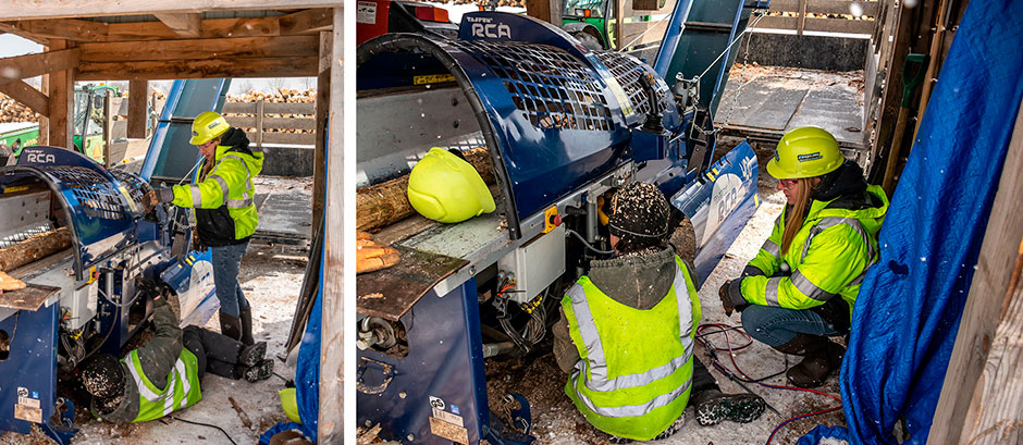 Two women working together to fix the processing equipment.