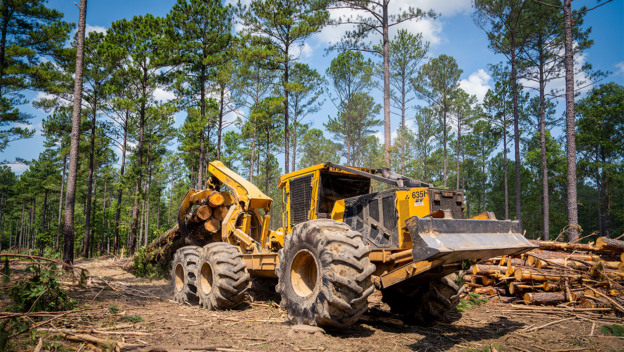 Image of a Mackolines Machines & Hire 635H bogie skidder working in the field