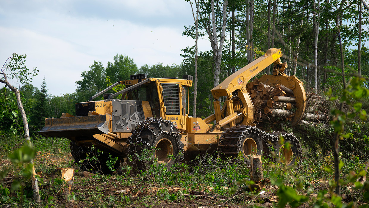 635H skidder moving wood