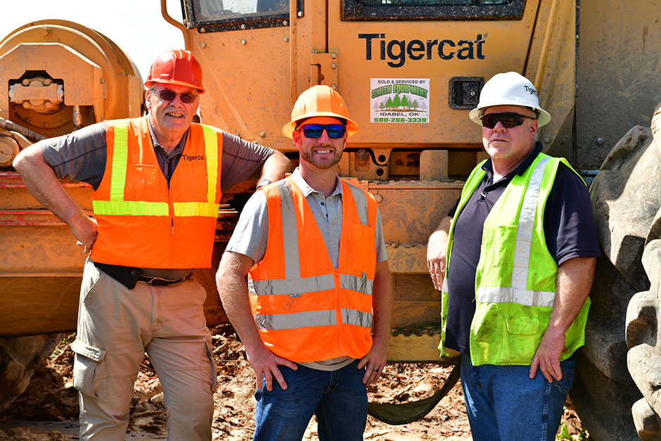 L-R: Heinz Pfeifer, Mackolines Machines & Hire district manager; Chris Gibson, owner of Chris Gibson Logging LLC; Jeff Reynolds, Smith Equipment sales specialist.