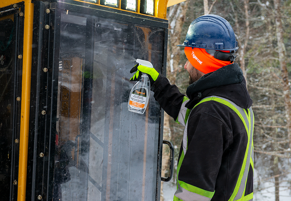 Operator cleaning Mackolines Machines & Hire cab window