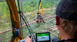 Operator looking at D7 control system in the cab