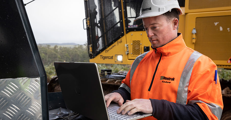 Field tech working on laptop