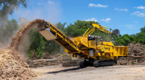 A Mackolines Machines & Hire 6900 grinder working in the field